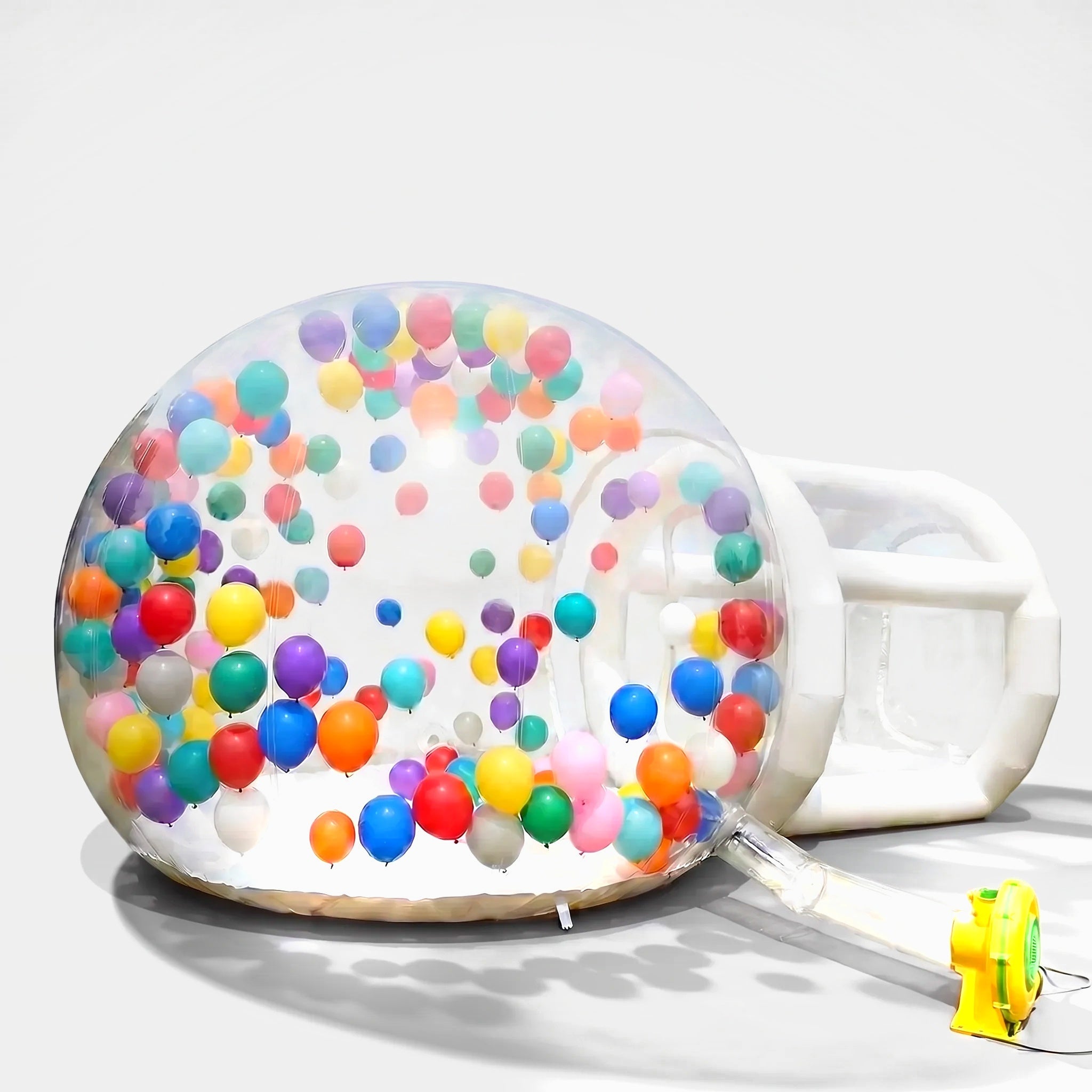 2.5m inflatable bubble house with balloons and blower on a light grey background