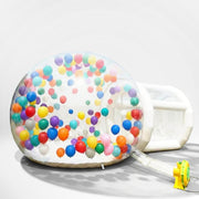 2.5m inflatable bubble house with balloons and blower on a light grey background