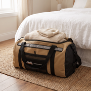 San Hima 50L duffel bag packed in a cottage bedroom
