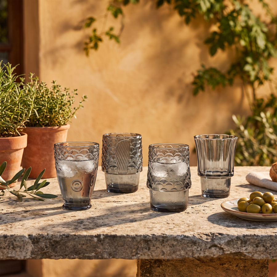 Four fish glasses on a Tuscan terrace table