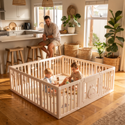 Two siblings playing inside the Little Rabbit Playpen in an open-plan family kitchen