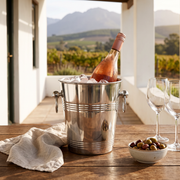 Silver ice bucket with rose on the stoep of a wine farm cottage
