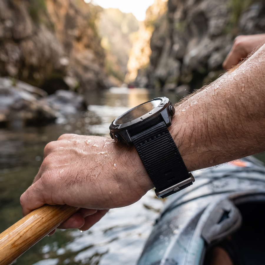 Deadtree Recon strap on a kayaker's wrist