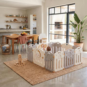 Dino Den Playpen in an open-plan living and dining area opening onto a sunny patio