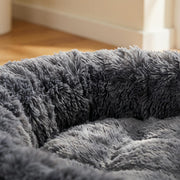 WuFF Giant Pet Bed close-up of the deep long-pile plush fur and raised bolster rim