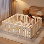 Mom and baby inside the Little Moon Playpen in a cosy nursery