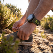 Deadtree Dash strap on a trail runner's wrist