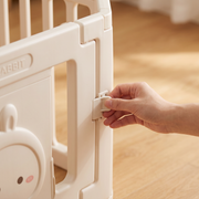 Close-up of the outside door latch on the Little Rabbit Playpen
