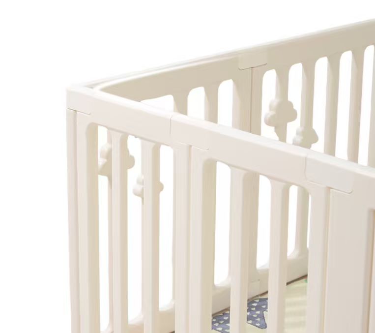 Close-up of the cloud-detail panels on the Little Rainbow Playpen