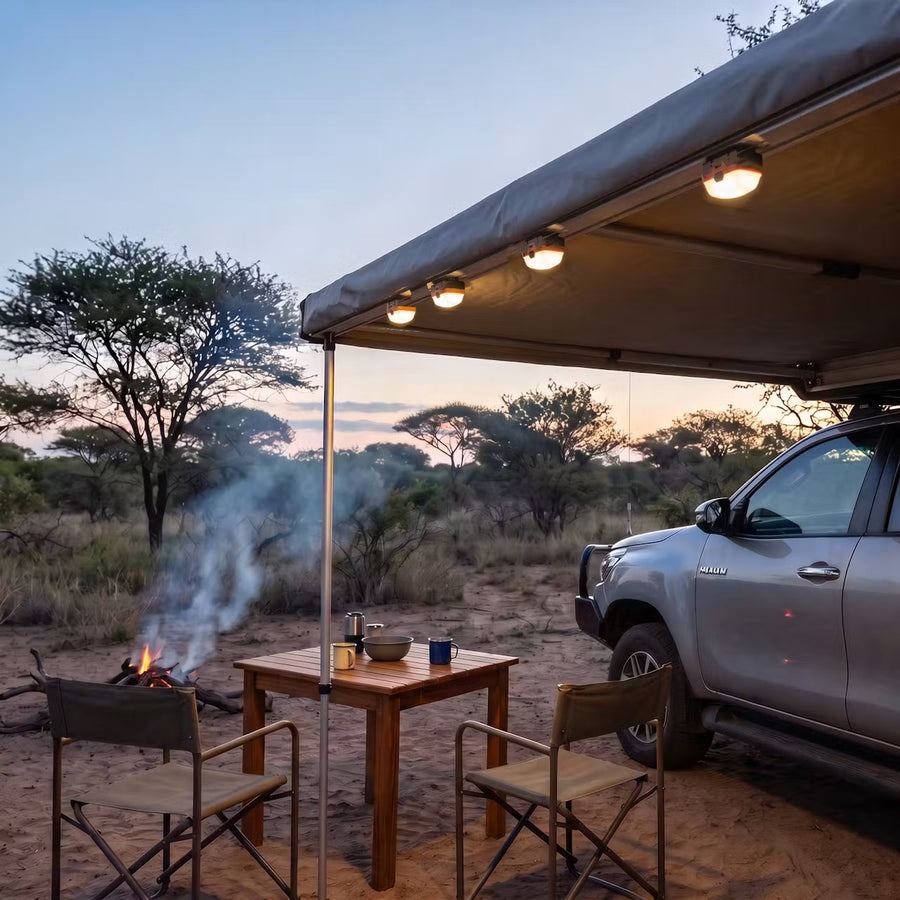 Mag Pod LED lights mounted magnetically under a 4x4 awning at a bush campsite