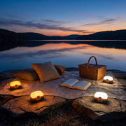 San Hima LED lights in white and amber at a lakeside picnic
