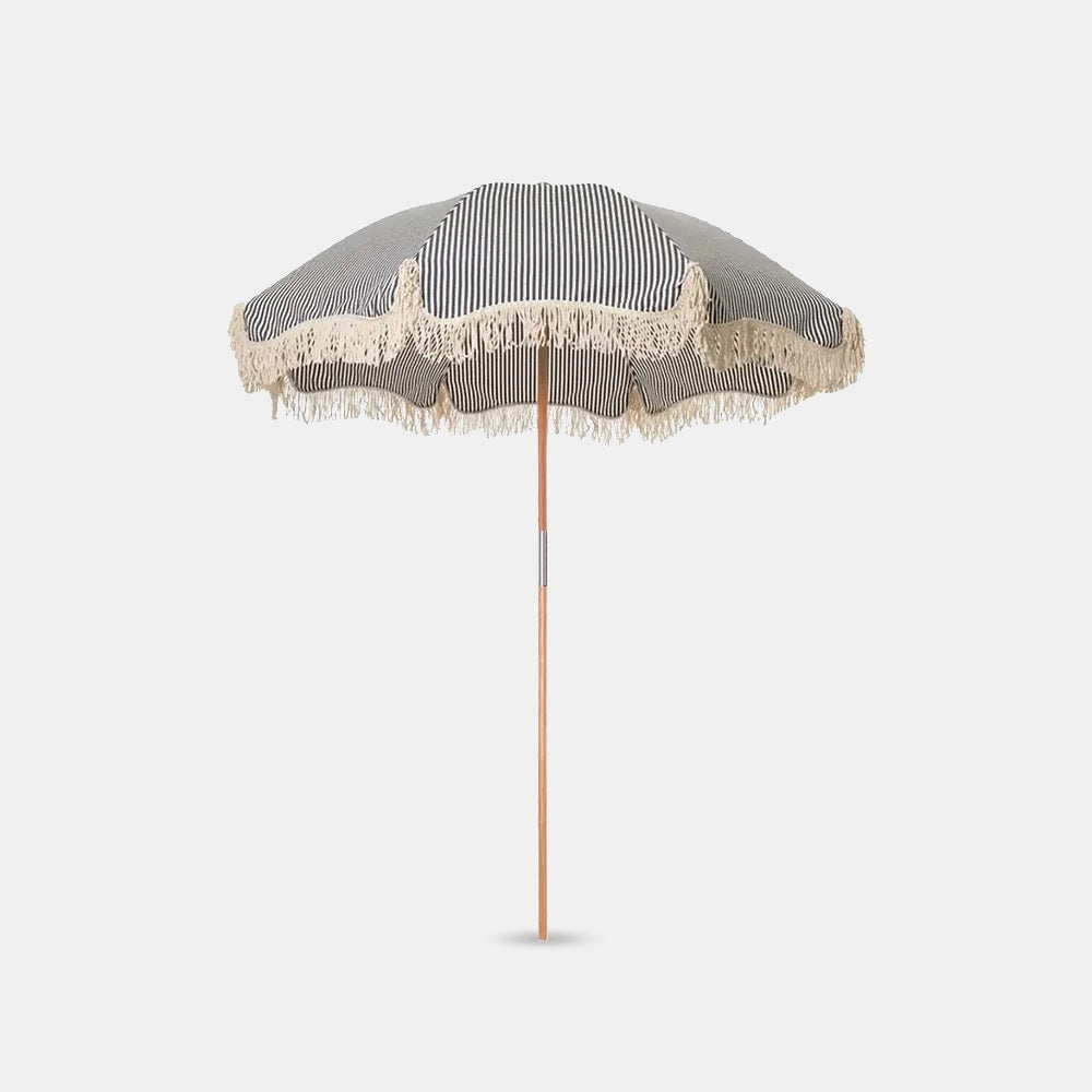 Betty's beach umbrella on a grey studio background