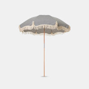 Betty's beach umbrella on a grey studio background