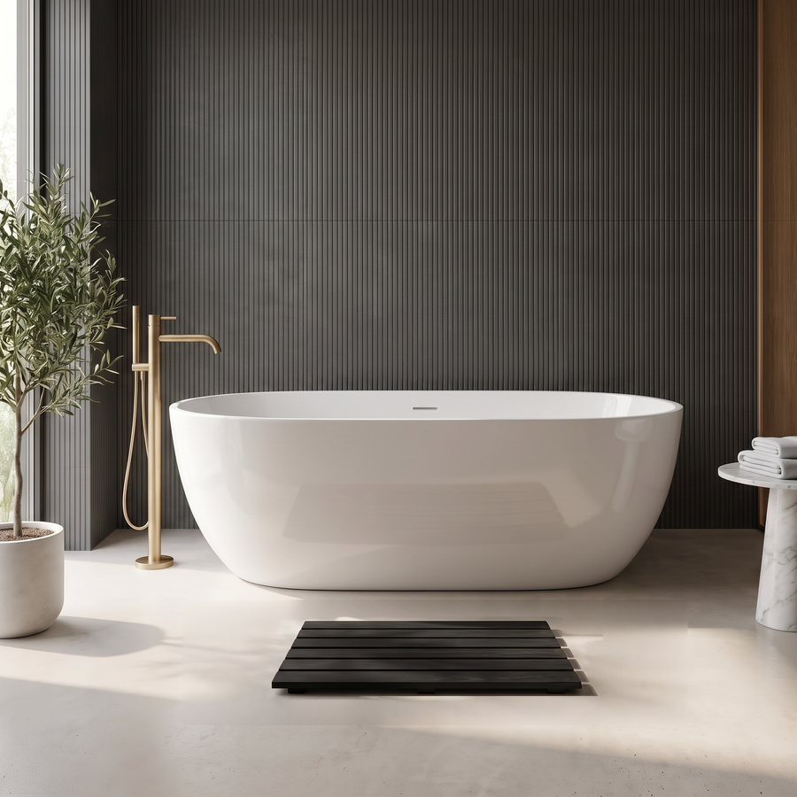 Black slatted bath mat in front of a white freestanding bath in a modern charcoal bathroom