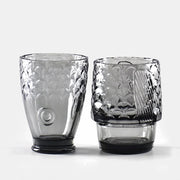 Close-up of the fish-scale detail on two fish stackable glasses