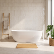 Light wood slatted bath mat in front of a white freestanding bath in a bright modern bathroom