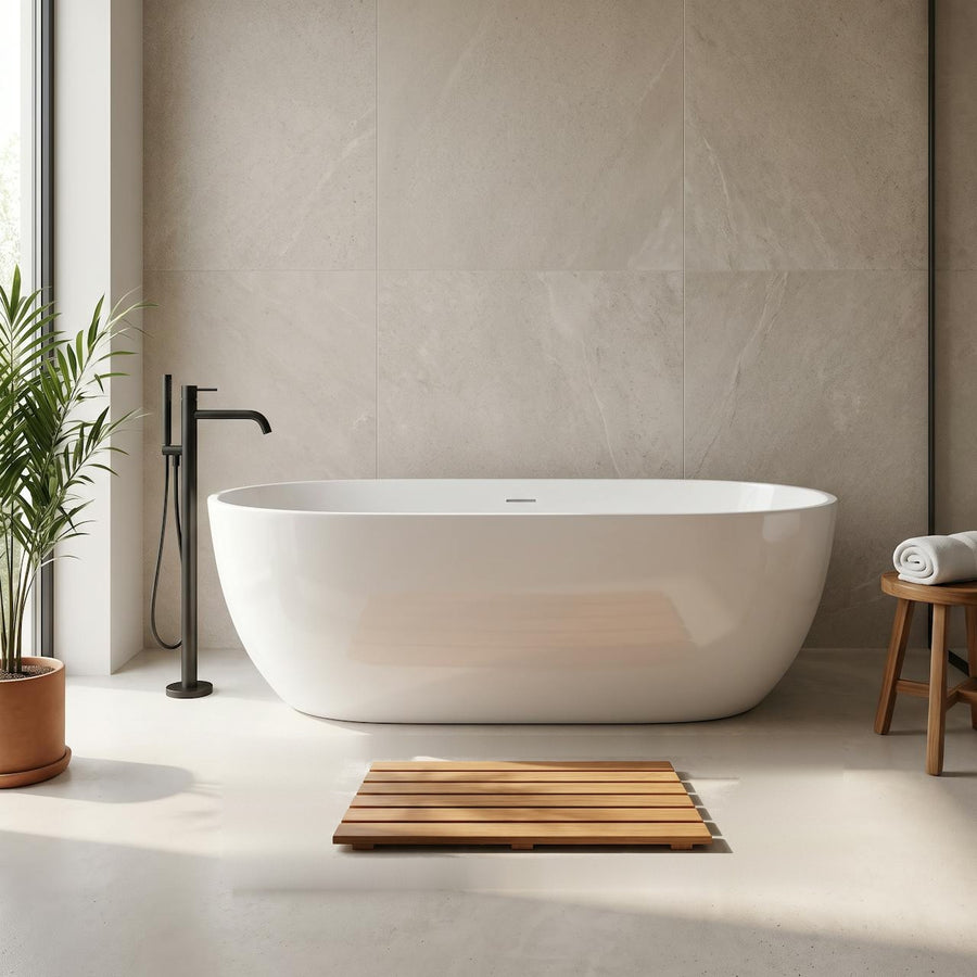 Slatted wooden bath mat in front of a white freestanding bath in a modern bathroom