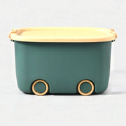 Play Time stackable storage box in green, front view on studio grey