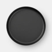 Cast Iron Plate on a light grey studio backdrop with a soft cast shadow