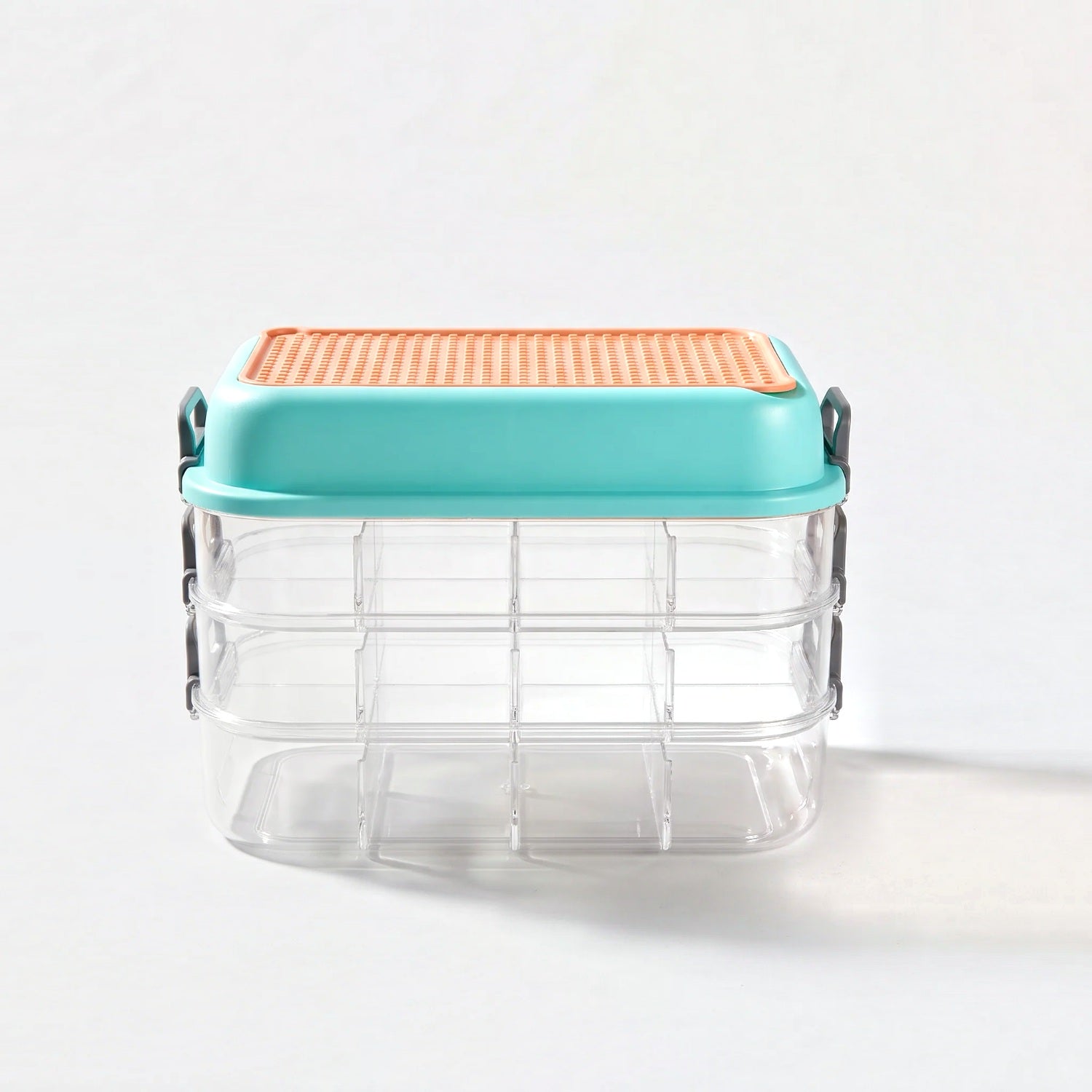Multi stackable 3 layer block organizer, studio shot on grey with cast shadow