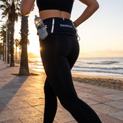 Runner wearing the Deadtree Stash Pack on a seaside promenade